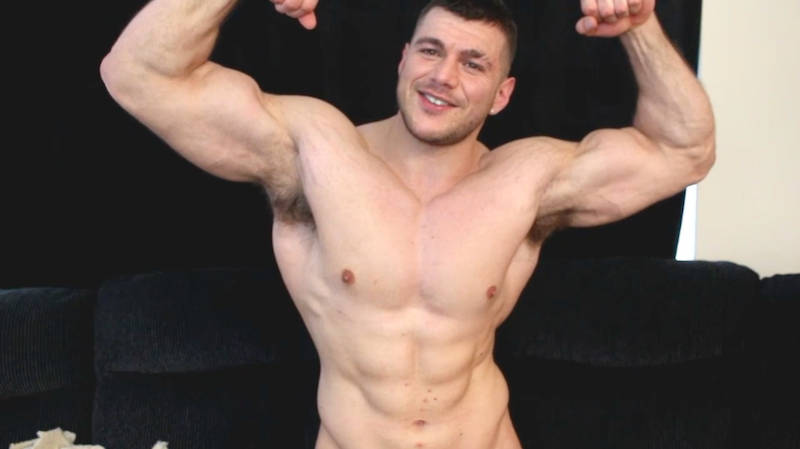 muscle man flexing in a wank video